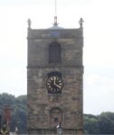 Old stone tower with two half life-size statues, Morpeth, Northumberland